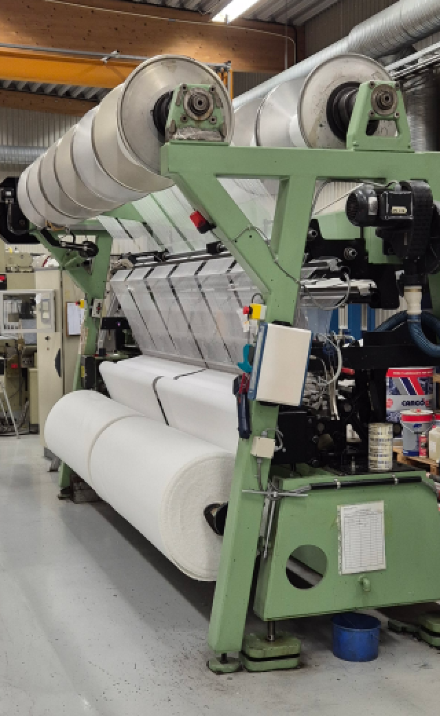 Textilmaskin för varptrikåproduktion